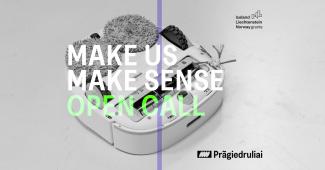 A white machine on a white background with the text "Make US Make Sense Open Call"
